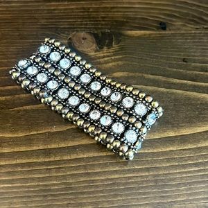 Two inch wide fancy bracelet.